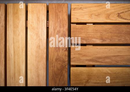 Top down detailed close up view of warm golden brown alder wood planks on sauna bench showcasing natural organic grain patterns, smooth texture, horiz Stock Photo