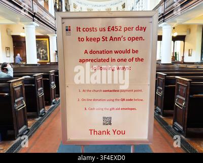 Manchester, UK - May 10, 2026: Sign in the nave of St Ann's Church Manchester requesting donations to cover daily operating costs. Stock Photo