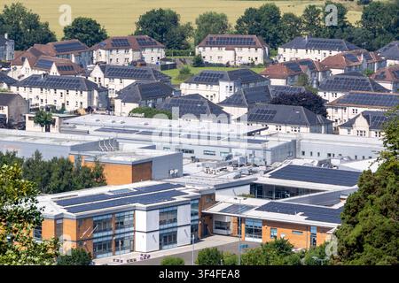 Residential buildings with rooftop solar panels are seen on the ...