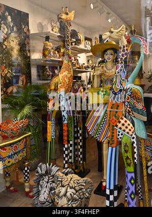 Colourful animal sculptures in shop (La Compagnie des Anges) window Antibes, France Stock Photo