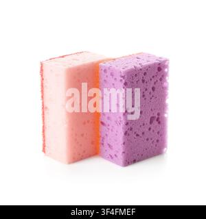 Two colorful kitchen sponges, pink and purple, for cleaning and household chores, isolated on a white background Stock Photo