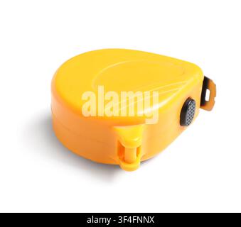 Yellow measuring tape with a black button and metal hook, construction and DIY tools, isolated on a white background Stock Photo