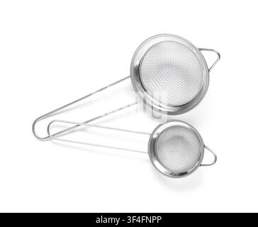 Two stainless steel kitchen strainers with fine mesh and long handles, essential cooking utensils for sifting and draining Stock Photo