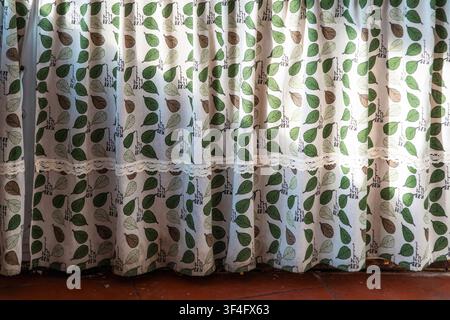 Patterned curtains with sunlight in cozy home Stock Photo