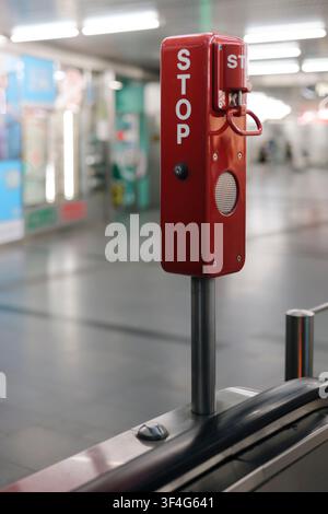 Emergency stop system on an escalator in a subway station illustrating the technical reliability of safety equipment. Stock Photo