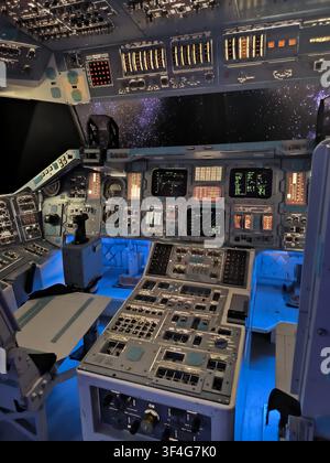 Interior view of a detailed spaceship cockpit simulator with control panels and starry space window view Stock Photo