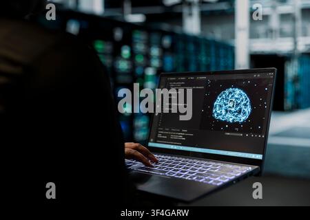 Close up of data center technician conducting tests on gear using neural networks to fix bugs. Server hub worker uses deep learning technology to refine algorithms for faster processing Stock Photo