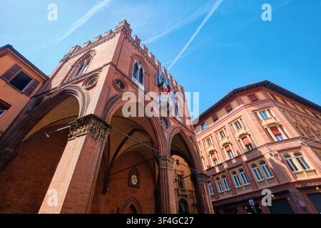 Bologna, Italy - May 2026: Low angle wide view of the historic Gothic Palazzo della Mercanzia with ornamental terracotta arches Stock Photo