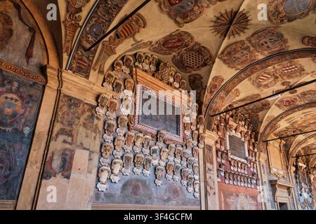 Bologna, Italy - May 2026: Low angle view of wall monuments and heraldic coats of arms at Archiginnasio di Bologna Stock Photo