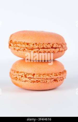 Orange Macarons Isolated on White Background Stock Photo