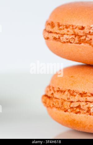 Orange Macarons Isolated on White Background Stock Photo