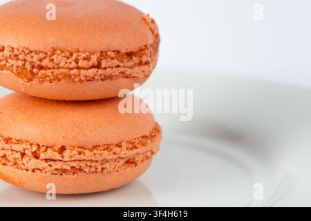 Orange Macarons Isolated on White Background Stock Photo