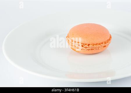 Orange Macarons Isolated on White Background Stock Photo