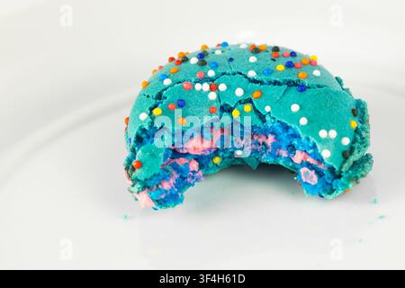 Birthday Cake Macaron with Bite Taken Out Stock Photo