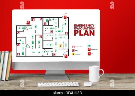 Emergency evacuation plan displayed on a computer screen in an office setting Stock Photo