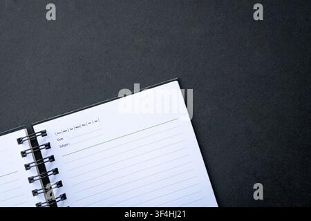Open notepad on top of dark background. Copy space. Stock Photo