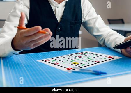 Emergency evacuation plan displayed on table during planning session Stock Photo