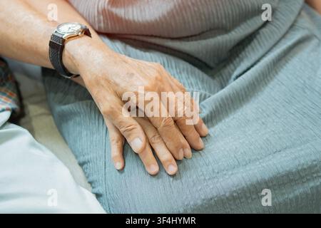 High angle view of couple and elderly people holding hands for support, love and care in home. Zoom, senior and hand together for bonding, anniversary Stock Photo