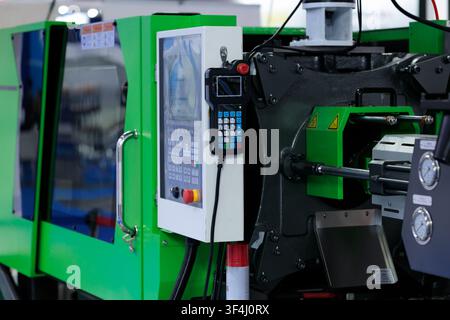 Automatic plastic injection molding machine close up. Selective focus. Stock Photo
