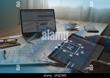 man review financial data on tablet beside laptop charts, calculator, reports, using AI dashboard overlays to support digital analysis, document compa Stock Photo