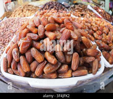 Close-up of a plate of dates for sale in a market in a souk in Morocco Stock Photo