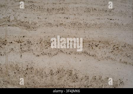 Light beige travertine marble stone texture background with warm porous surface Stock Photo
