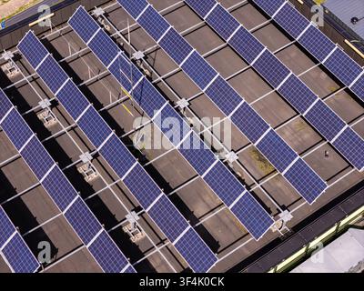 Aerial view of solar panels installed on a flat roof in Poland. Stock Photo
