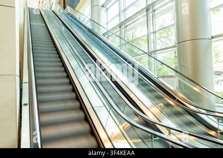 Empty escalators in modern building Stock Photo