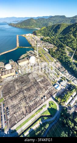 Aerial view of an electrical substation nestled within a dense forest ...
