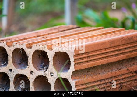 A single brick on the ground in the backyard with a creamy smooth background Stock Photo