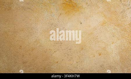 Abstract light golden beige cement wall texture background with subtle grainy texture Stock Photo