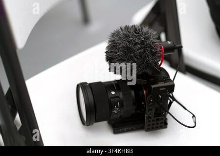 Mirrorless Camera with External Microphone for Video Production Stock Photo