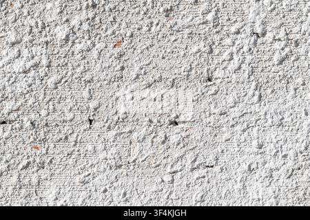 background texture of a white rough wall with coarse mortar plaster surface Stock Photo