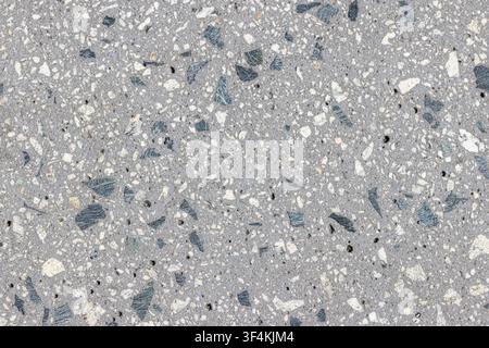 Abstract background of a polished aggregate concrete. Full frame Stock Photo