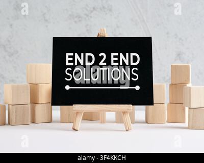 Chalkboard with end 2 end solutions text, symbolizing comprehensive business strategies and efficient process management Stock Photo