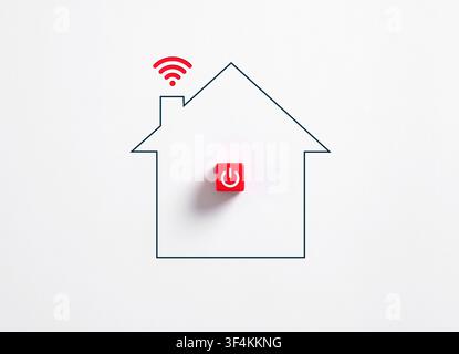 Minimalist conceptual imagery of smart home automation and internet of things showing a house outline with a red power button and WIFI signal on a whi Stock Photo