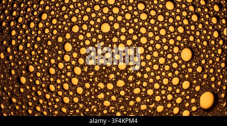Macro view of connected golden bubbles creating an abstract pattern Stock Photo