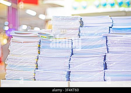 Lined and squared notebooks stacked in blocks on shelves. Getting ready for school, back to school Stock Photo