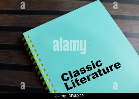 Concept of classic literature write on book isolated on Wooden Table. Stock Photo