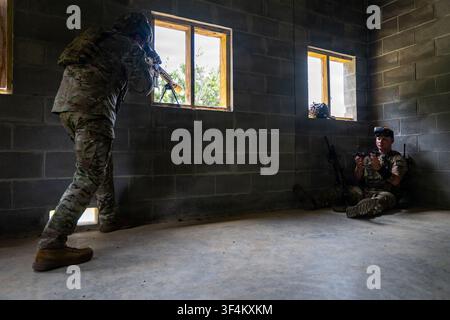 U.S. Air Force Technical Sergeant Natanael Noronha, an instructor supervisor with the 820th Combat Operations Squadron, and Staff Sergeant Conner Montgomery, a force production analyst with the 824th Base Defense Squadron, practice First Person View drone tactics at Moody Air Force Base in Georgia, on July 14, 2026, as part of Air Combat Command's 93d Air Ground Operations Wing operations. Stock Photo