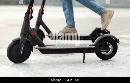 Person having pleasant ride on electric kick scooter Stock Photo