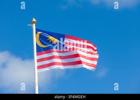 The flag of Malaysia, known as the Jalur Gemilang (Stripes of Glory) flying in Scotland during the Glasgow 2026 Commonwealth Games Stock Photo