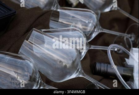 Close-up of empty wine glasses arranged in a row with selective focus. Stock Photo