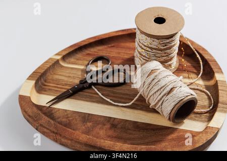 Rustic Craft Twine Spools and Vintage Scissors on Wooden Tray Stock Photo