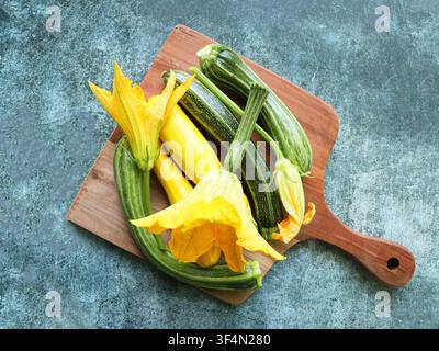 Fresh Zucchini and Squash With Blossoms on Cutting Board Stock Photo