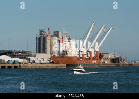 Southampton Docks southern England UK. 26.07.2026. A massive cargo vessel is moored at a port facility, in Southampton its deck laden with components Stock Photo
