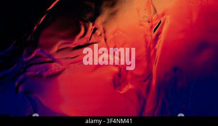 Abstract fluid art background showing dynamic motion and organic shapes with vibrant red and blue colors Stock Photo
