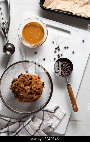 A bowl of mixture for making peanut butter chocolate chip energy balls. Stock Photo