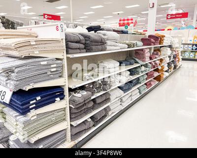 Shelves in a retail store filled with neatly folded bath mats and towels. - 07.05.2026, Auburn WA, USA. Stock Photo