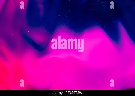 Abstract paint swirling, blending vibrant colors, creating a dynamic liquid texture Stock Photo